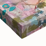 Close-up view of a stretched canvas showcasing vibrant African tribal art, highlighting intricate patterns and textures, perfect for home decor enhancement.