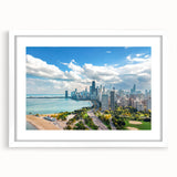 Abstract art print featuring swirling blue and gray tones on a framed canvas, suitable for bedroom or dining room decor.