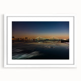 Abstract art print featuring swirling blue and gray tones on a canvas, suitable for modern bedroom or dining room decor.