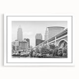 Abstract art print featuring swirling blue and white patterns on a rolled canvas.