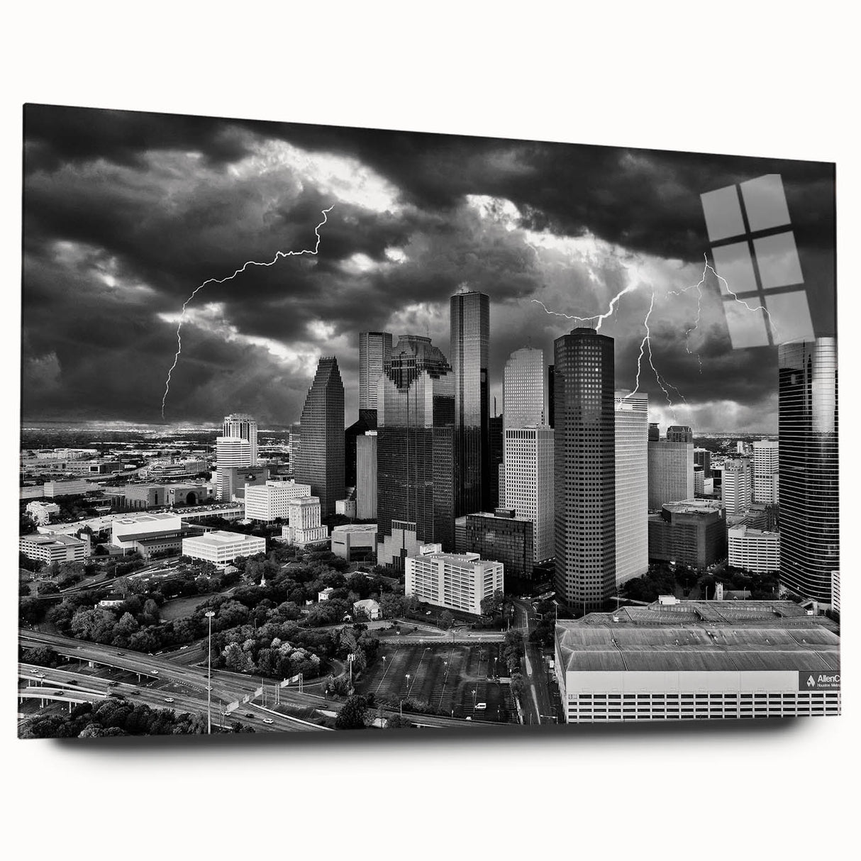 Large abstract wall art featuring swirling blue and gray tones on a rolled canvas.
