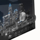 Large abstract wall art in mid-century modernist style, featuring swirling blue and gray tones on canvas.