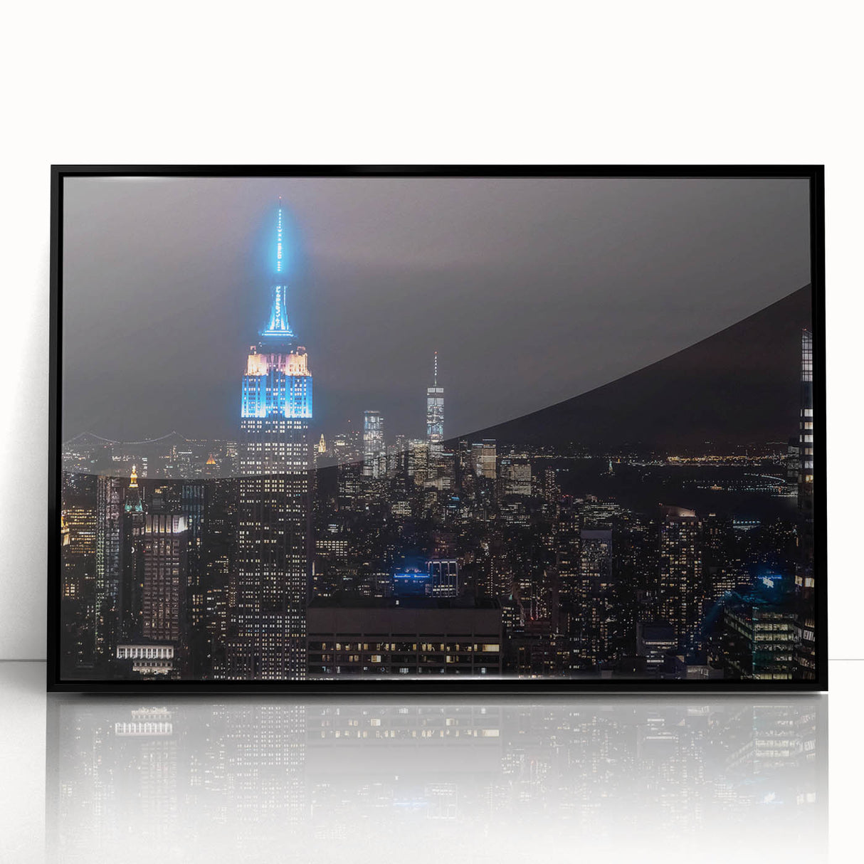 Large abstract wall art featuring swirling blue and gray tones on canvas, ideal for modern living room decor.