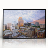 Large abstract wall art featuring swirling blue and orange hues on canvas, ideal for modern living room decor.