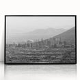 Large abstract wall art featuring swirling blue and gray hues on canvas, ideal for modern living room decor.