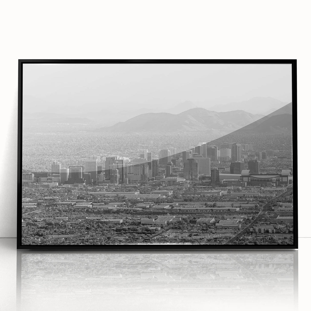 Large abstract wall art featuring swirling blue and gray hues on canvas, ideal for modern living room decor.