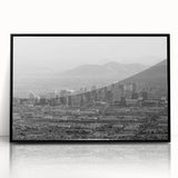 Large abstract wall art featuring swirling blue and gray hues on canvas, ideal for modern living room decor.