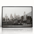 Large abstract wall art featuring swirling blue and gray tones on canvas, suitable for modern living room decor.