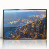 Large art print of a mid-century modernist cityscape in muted orange and teal tones on canvas.