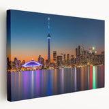 A large abstract canvas print featuring swirling blue and green hues, ideal for kitchen wall art.