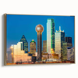 Landscape painting of a serene lake at sunset with muted blue and orange tones, printed on a black framed canvas.