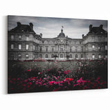 Elegant Black and White Palace Facade with Vibrant Floral Gardens