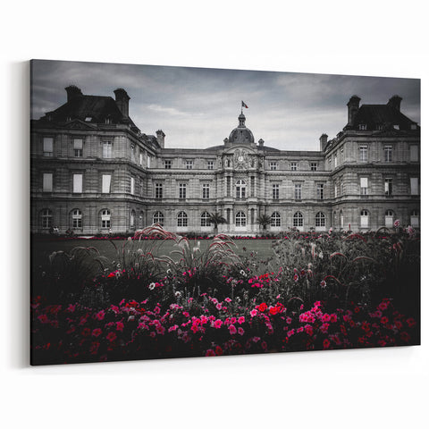 Elegant Black and White Palace Facade with Vibrant Floral Gardens