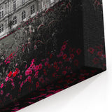 Elegant Black and White Palace Facade with Vibrant Floral Gardens