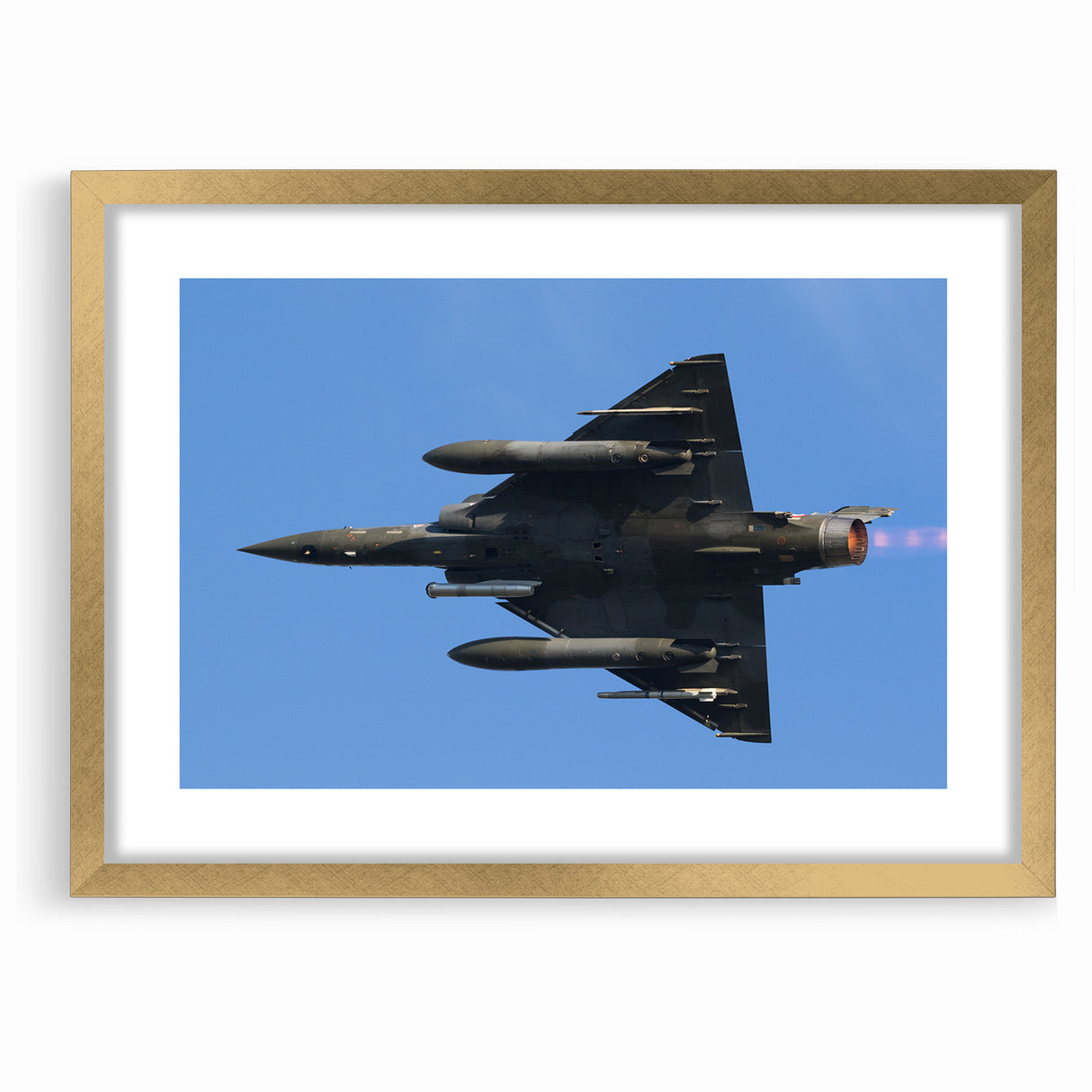 Modern Aviation Art: Fighter Jet in Flight Against Blue Sky Canvas Print