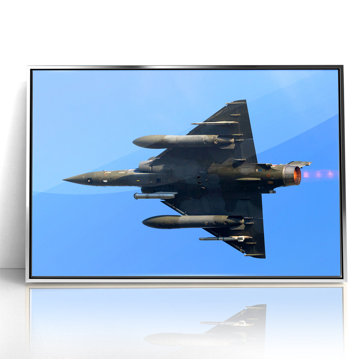 Modern Aviation Art: Fighter Jet in Flight Against Blue Sky Canvas Print