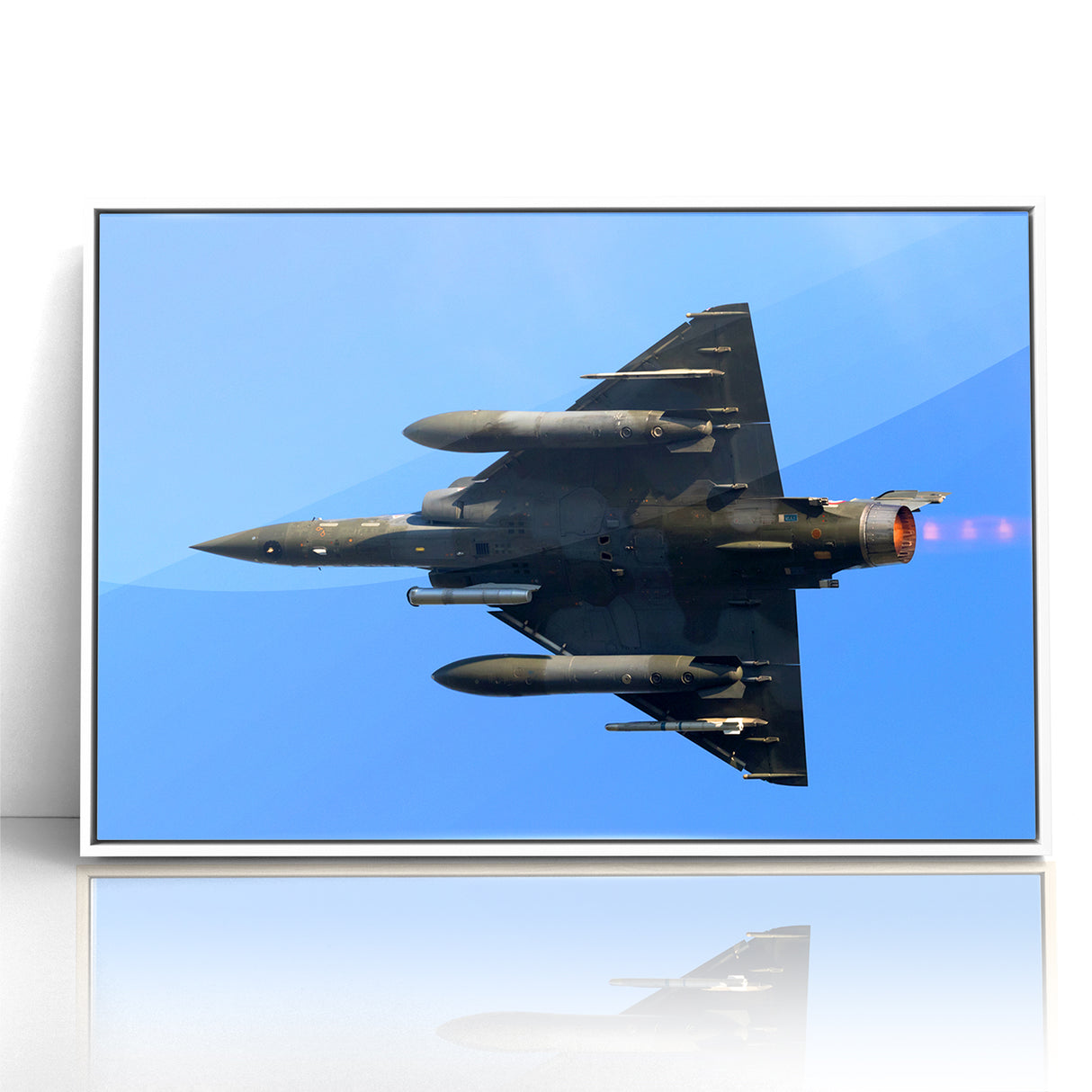 Modern Aviation Art: Fighter Jet in Flight Against Blue Sky Canvas Print