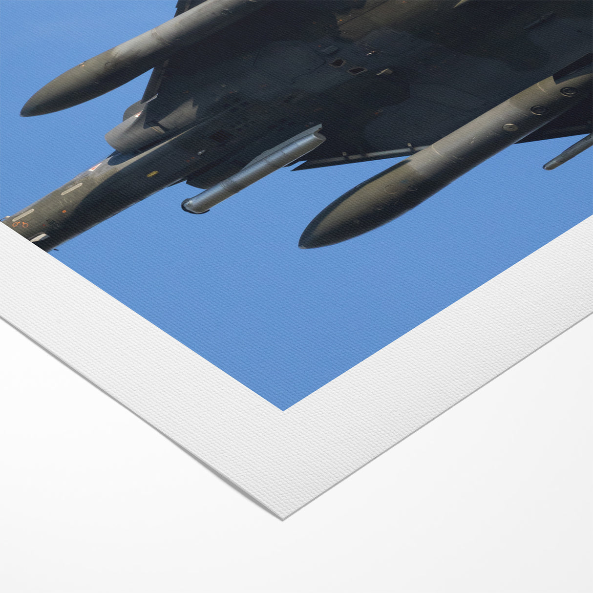 Modern Aviation Art: Fighter Jet in Flight Against Blue Sky Canvas Print