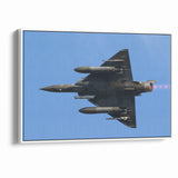 Modern Aviation Art: Fighter Jet in Flight Against Blue Sky Canvas Print