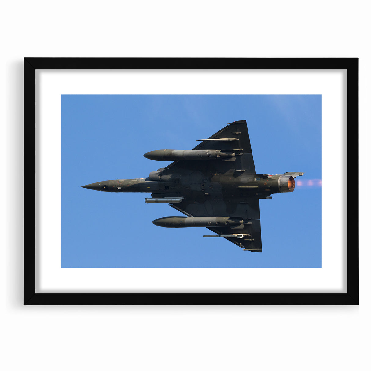 Modern Aviation Art: Fighter Jet in Flight Against Blue Sky Canvas Print