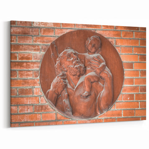 Masonry Wall Art - Religious Relief Sculpture on Brick Wall Canvas Print