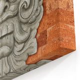 Masonry Wall Art - Intricate Carved Figure on Rustic Brick Canvas Print