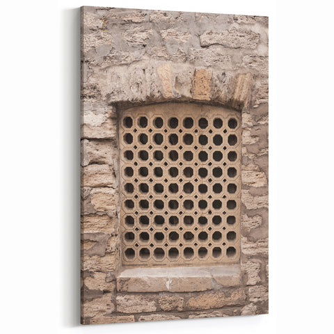 Masonry Wall Art - Hexagonal Patterned Window on Stone Wall Canvas Print