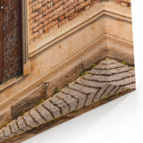 Masonry Wall Art - Ornate Wooden Door on Brick and Stone Wall Canvas Print