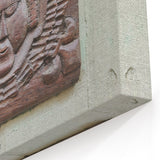 Masonry Wall Art - Rustic Wooden Carved Face Relief on Stone Canvas Print