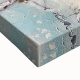 Close-up of a stretched canvas print showcasing vibrant abstract art with bold colors and intricate textures, ideal for modern home decor and artistic spaces.