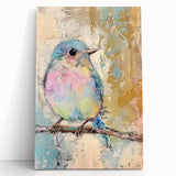 Stretched canvas artwork depicting a vibrant abstract landscape with rich colors, leaning against a textured wall, ideal for modern home decor.