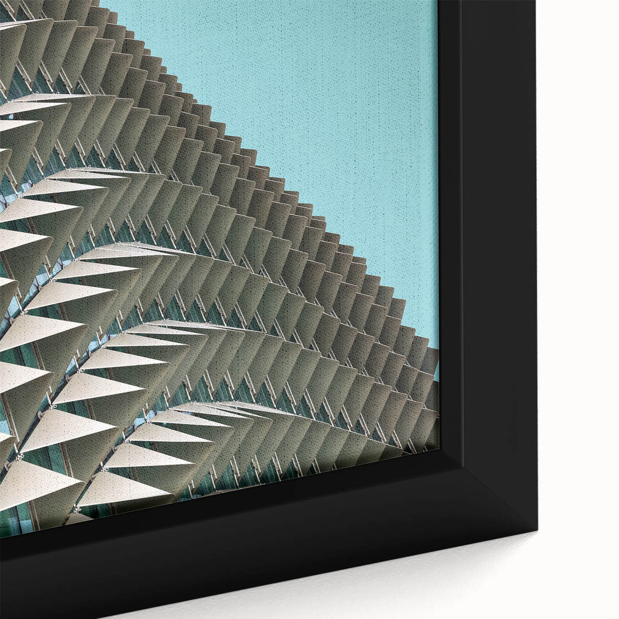 Close-up of black textured wall art with colorful abstract designs on a large framed canvas, suited for living room decor.
