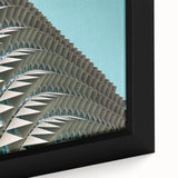 Close-up of black textured wall art with colorful abstract designs on a large framed canvas, suited for living room decor.