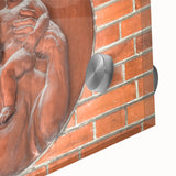 Large abstract wall art in vibrant orange and yellow tones on acrylic glass.