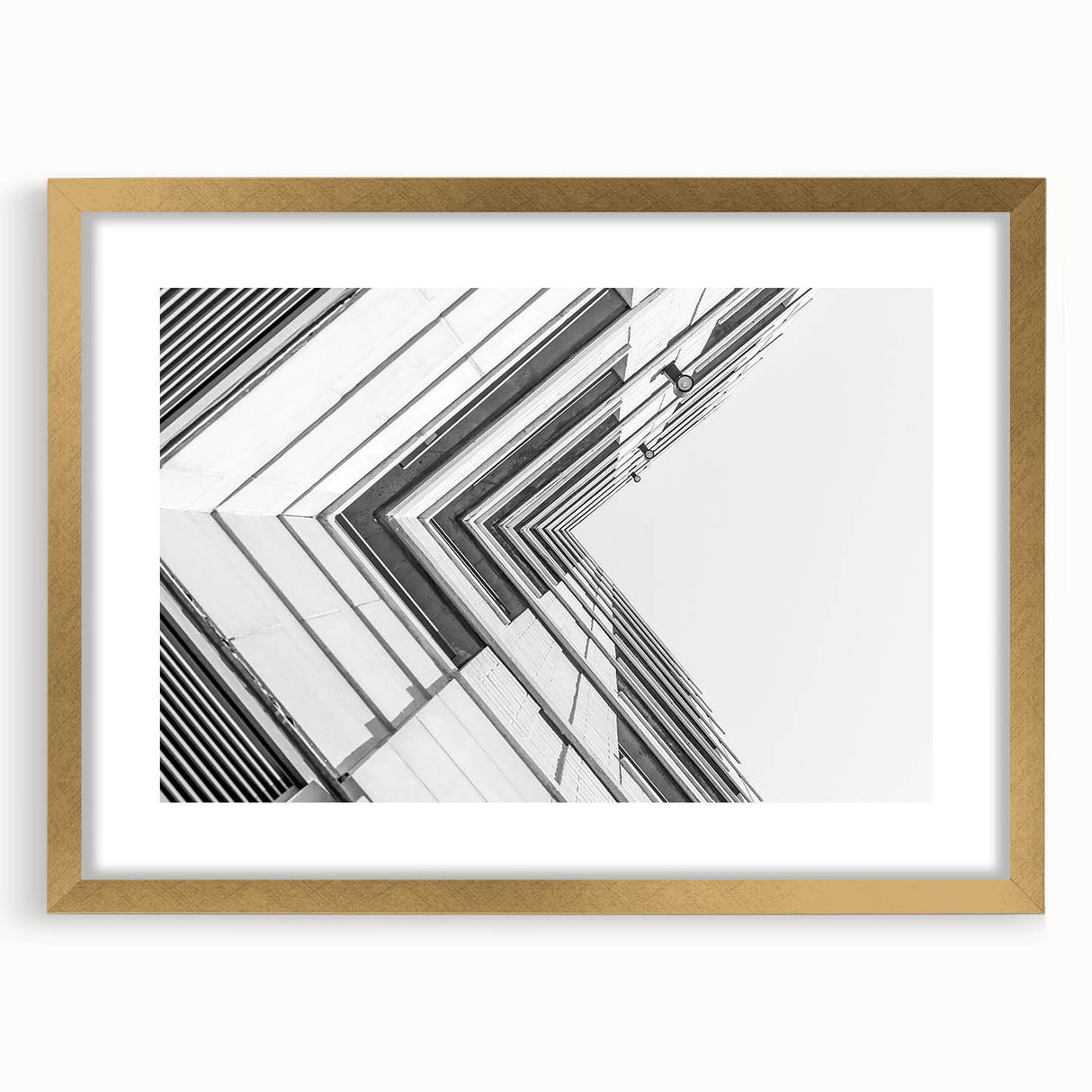 Textured abstract art print in muted gray and gold tones on a framed canvas, ideal for modern bedroom ambiance.
