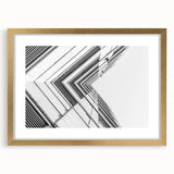 Textured abstract art print in muted gray and gold tones on a framed canvas, ideal for modern bedroom ambiance.