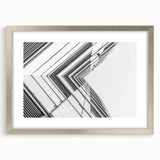 Abstract art print featuring swirling blue and gray tones on a framed canvas, suitable for dining room or bedroom.