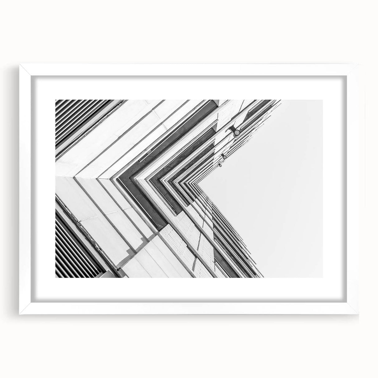 Extra large abstract art print featuring textured swirls in muted gray and blue tones, framed in white.