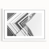 Extra large abstract art print featuring textured swirls in muted gray and blue tones, framed in white.