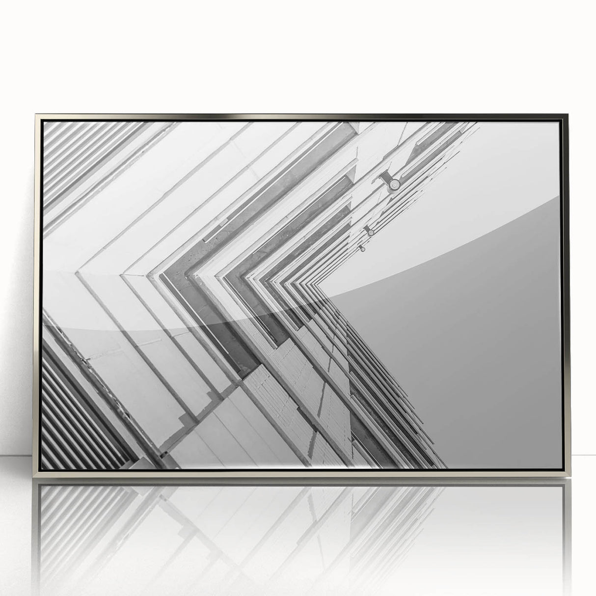 Art deco poster featuring geometric patterns in silver and black on a framed acrylic, suitable for modern nursery wall decor.