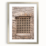 Textured abstract art print in gray and white, framed in silver, ideal for modern bedroom ambiance.