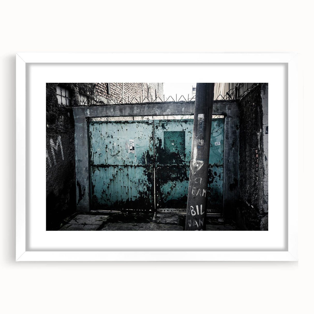 Abstract art print featuring swirling blue and gray tones on a framed white canvas.