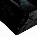 Large art of a black and white landscape painting on stretched canvas, featuring a serene tree-lined river.