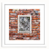 Abstract art print featuring swirling blues and grays on a white framed canvas, suitable for bedroom or dining room decor.