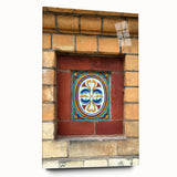 Large abstract wall art in vibrant blue and orange tones on acrylic glass, suitable for bedroom or dining room decor.