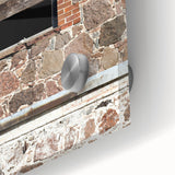 Large abstract wall art in vibrant orange and blue hues on acrylic glass, ideal for dining room ambiance.