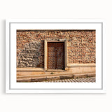 Abstract art print featuring swirling blue and gray patterns on a white framed canvas.