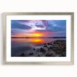 Textured abstract art print in muted gray and blue tones on a framed canvas, ideal for modern bedroom ambiance.