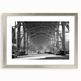 Abstract art print featuring swirling blue and white patterns on a silver-framed canvas.