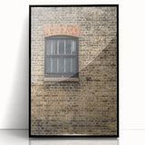 Large abstract wall art featuring swirls in muted gray and blue tones, framed in black acrylic.